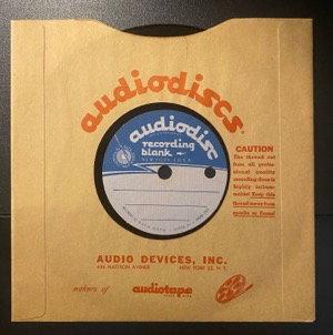 acetate 6-5 inch single dubplate (small-hole black) {audiodisc label} [in branded sleeve]